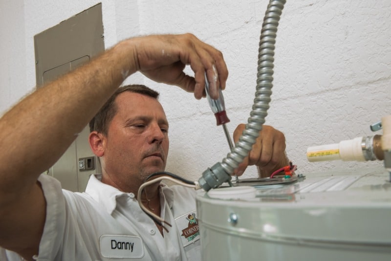 man fixing equipment